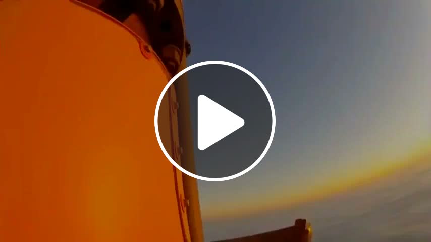 POV of a man climbing a 2000 ft radio tower in order to change a light ...