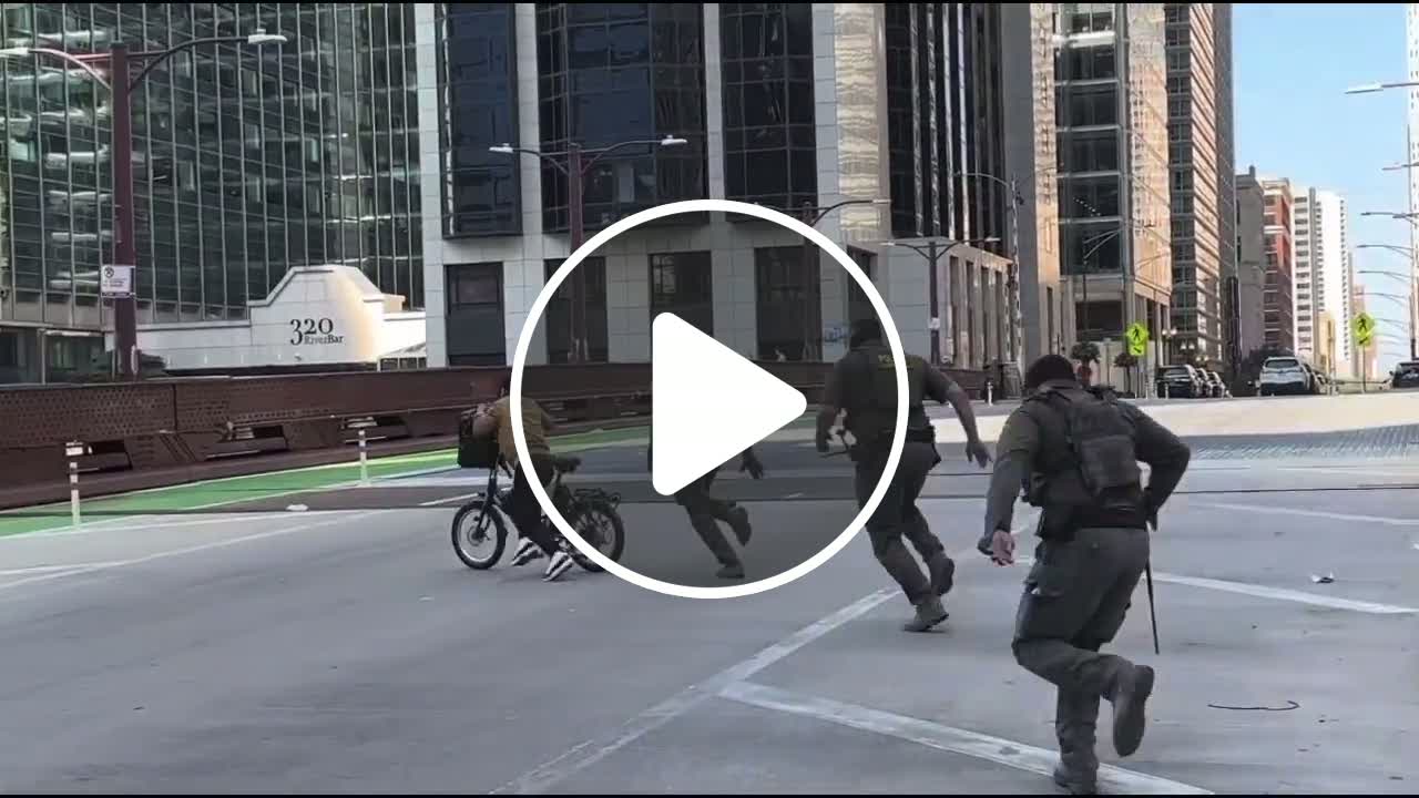 ICE agents chase immigrant cyclist in a Benny Hill-style comedy chase ...
