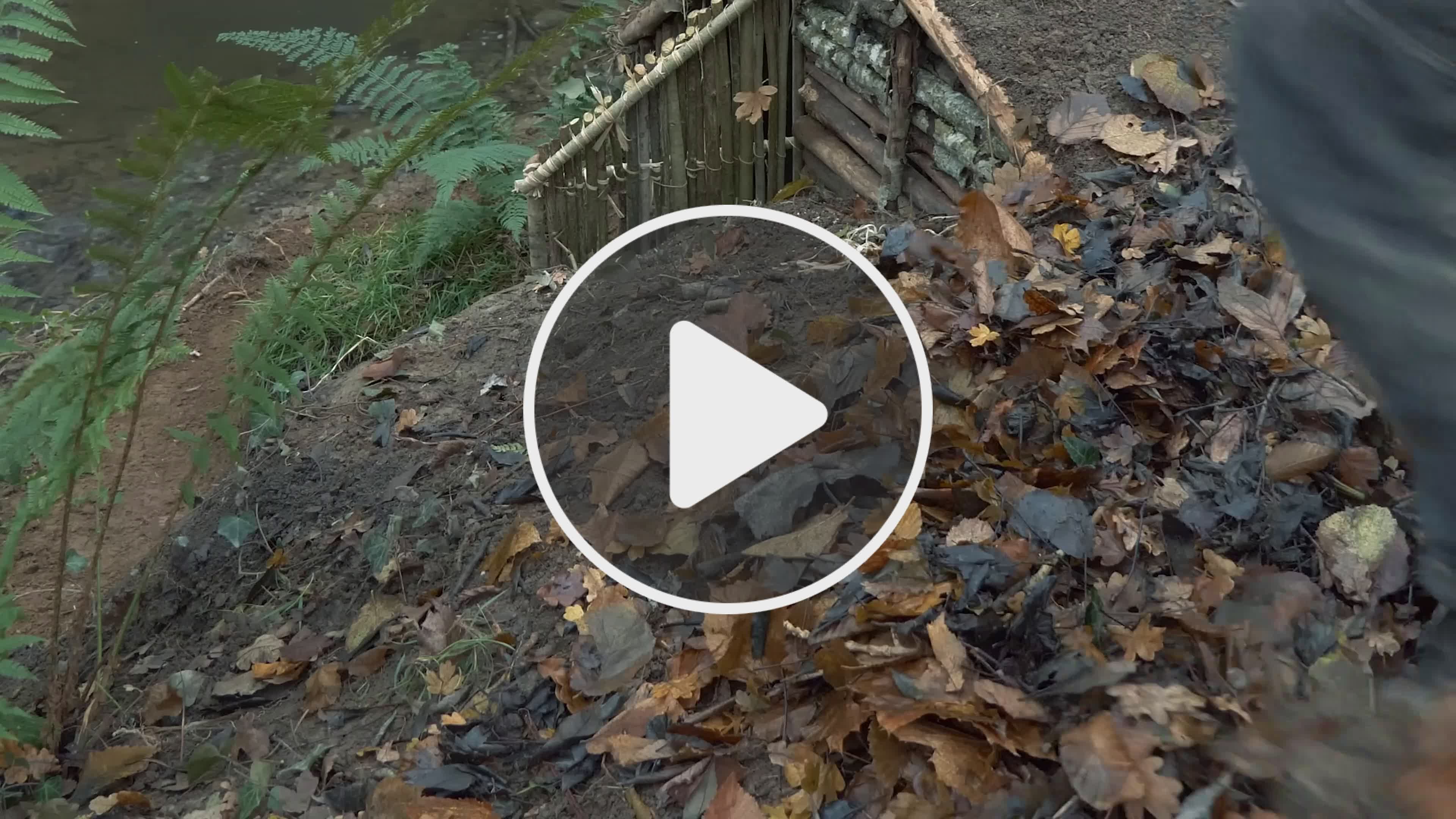 Building complete and warm survival shelter Bushcraft earth hut, grass ...